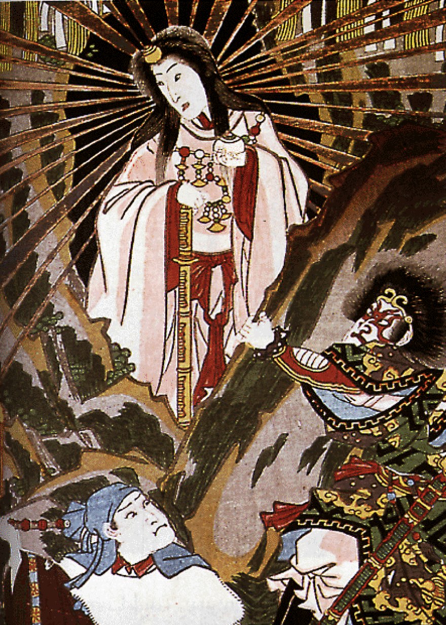 Japanese woodblock print of the sun-goddess Amaterasu, white-robed with loose black hair and gold rays streaming from her head, emerging from the mouth of the Heavenly Rock-cave; the fierce-faced strong-god Ta-jikara-wo grasps her hand to draw her out while another deity kneels gazing up at the returning light.