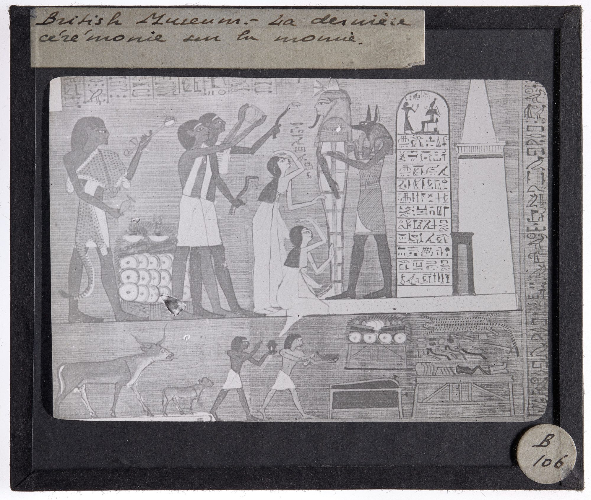 Detail from the Book of the Dead of Hunefer: jackal-headed Anubis performs the Opening of the Mouth ceremony before the tomb, steadying the upright mummy of the scribe while mourners kneel and priests bear offerings.