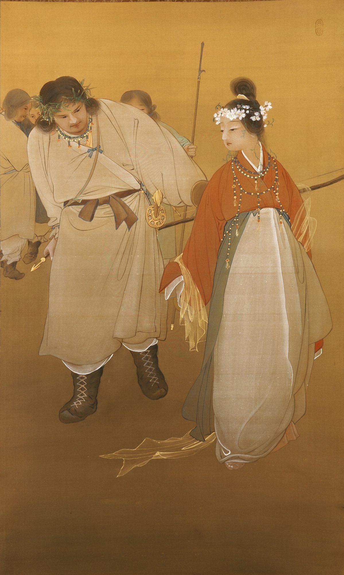 Japanese silk painting of Ninigi-no-Mikoto, the heavenly grandchild, striding in a pale robe with a leafy crown, jewelled necklaces and a gold-fitted sword, beside the blossom-princess Konohana-sakuya-hime, who is crowned with cherry blossom and robed in vermilion over pale green; attendants follow softly behind against a gold ground.