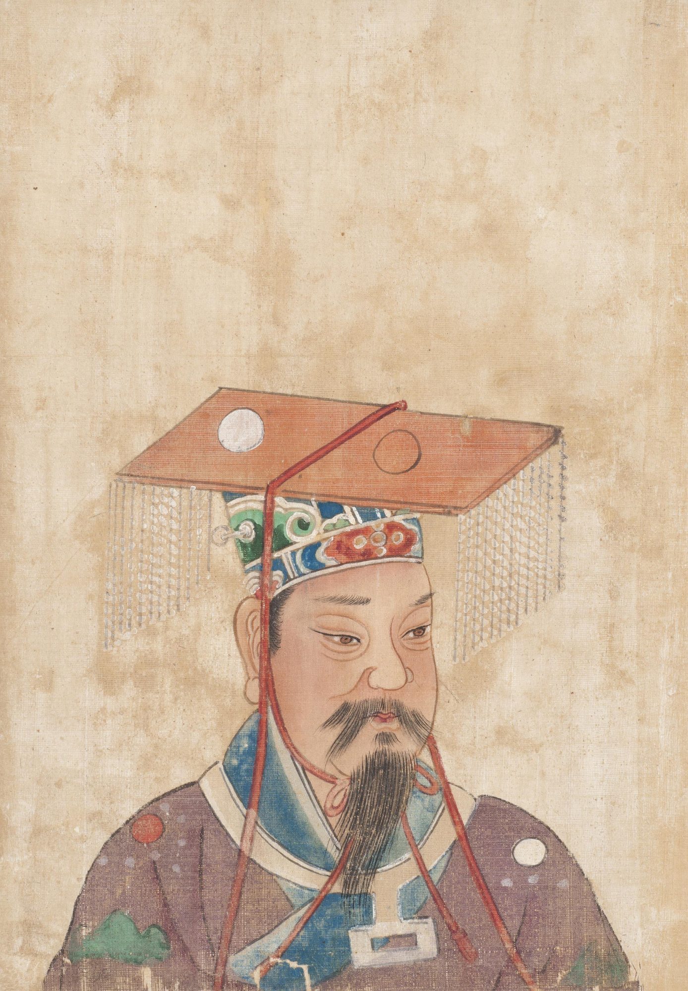 Ink-and-colour album-leaf portrait of the Yellow Emperor as Son of Heaven, shown in bust length wearing the flat-boarded mianguan crown with beaded tassel strings and a dragon-robe over a blue collar, against a plain aged-silk ground.