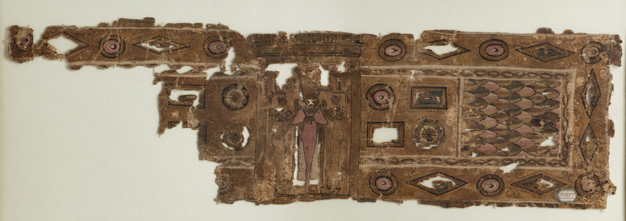Roman-period Egyptian funerary shroud in painted linen: the mummiform god Osiris lies at the centre on a bier, green-skinned, arms crossed over his chest; the goddesses Isis and Nephthys stand or kneel at head and foot with hands raised in mourning; winged deities and columns of hieroglyphs fill the surrounding bands.