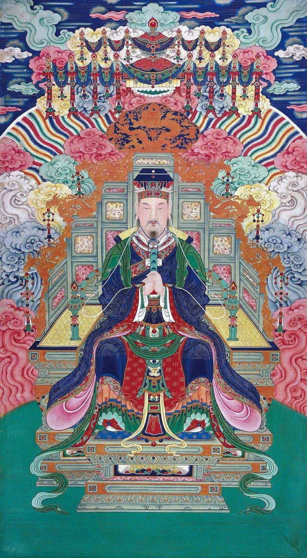 Ming-dynasty Daoist temple painting of the Jade Emperor enthroned in imperial court robes, wearing the flat mortarboard crown (mianguan) with hanging bead-strings and holding a ceremonial gui tablet in both hands, seated beneath a dragon canopy on a stepped throne amid coloured clouds.