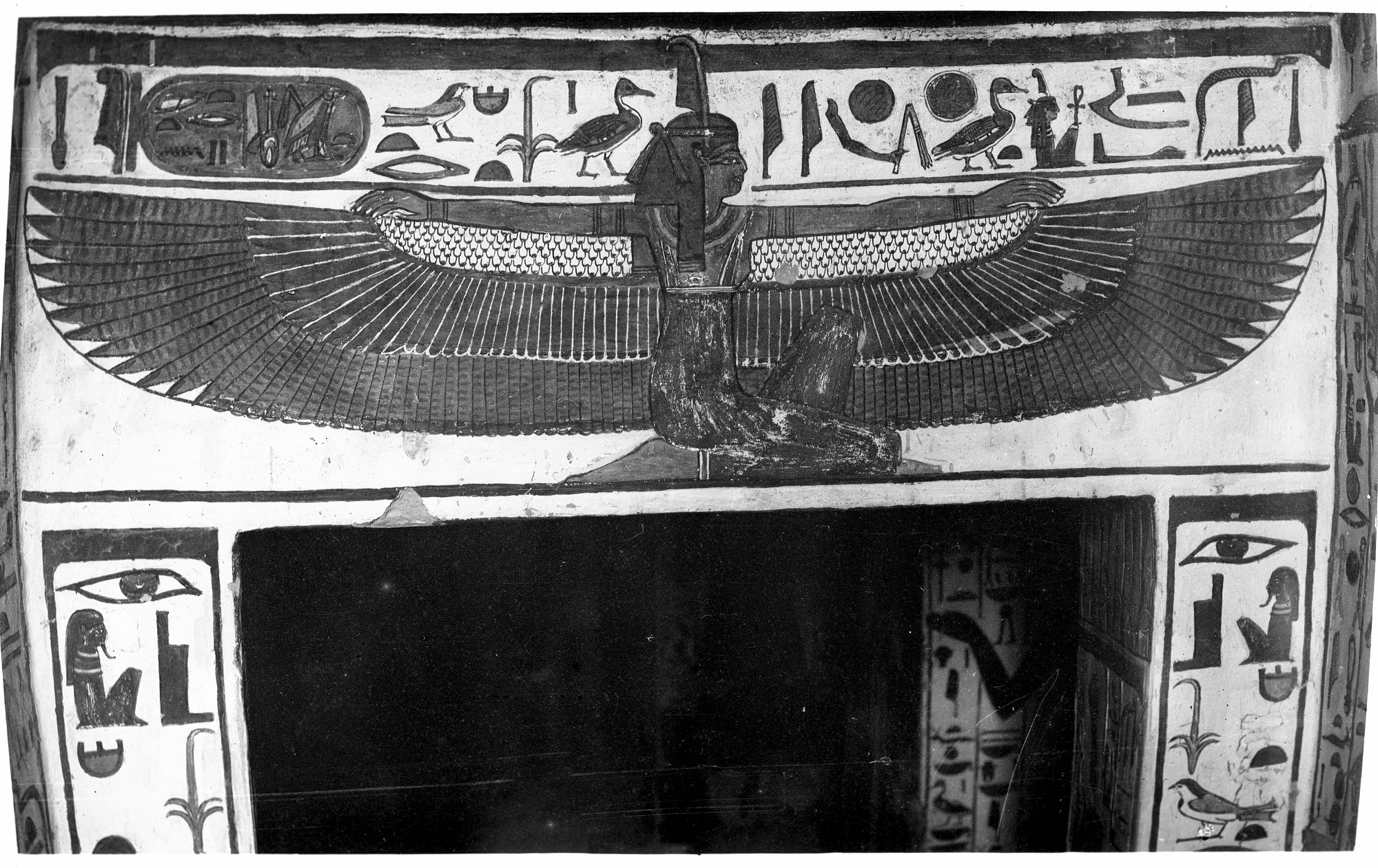 An ancient Egyptian tomb painting from the tomb of Nefertari: the winged goddess Maat kneeling on the lintel of the burial chamber, her great wings spread, facing east.