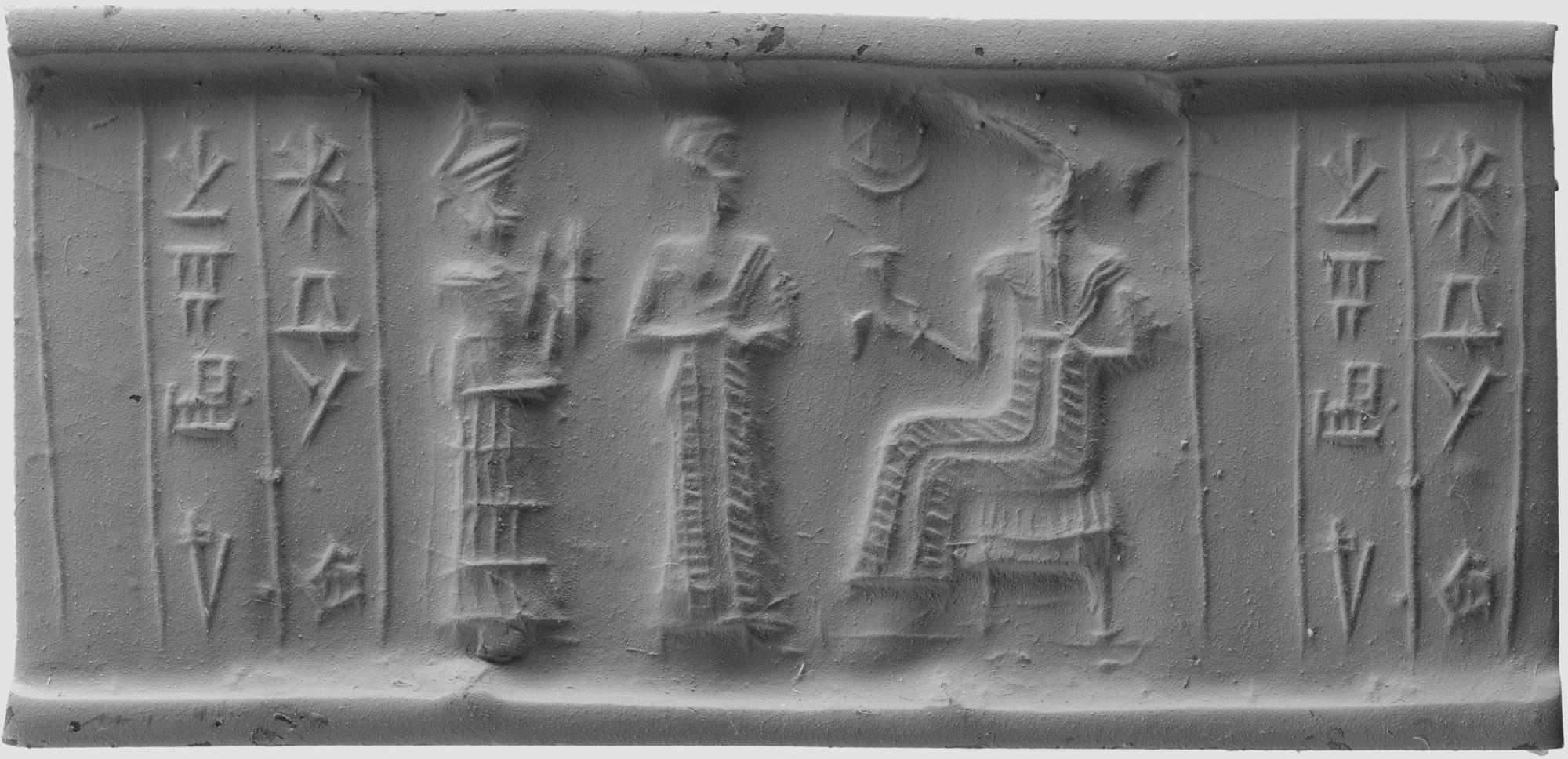 The modern grey rolled impression of a Mesopotamian cylinder seal: a standing worshipper and an interceding goddess with both hands raised approach a deity enthroned on a tiered throne, a crescent moon above, with panels of cuneiform to either side.